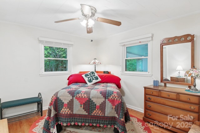 51 Atari Rd, Waynesville, NC 28786 - bedroom with wood finished floors, ornamental molding, a ceiling fan, and baseboards