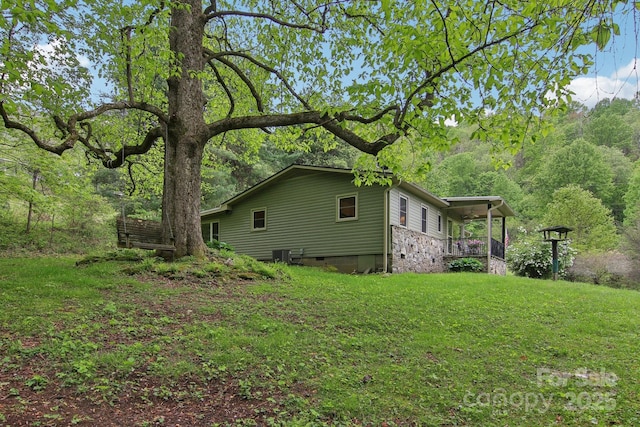51 Atari Rd, Waynesville, NC 28786 - view of home's exterior featuring crawl space and a lawn
