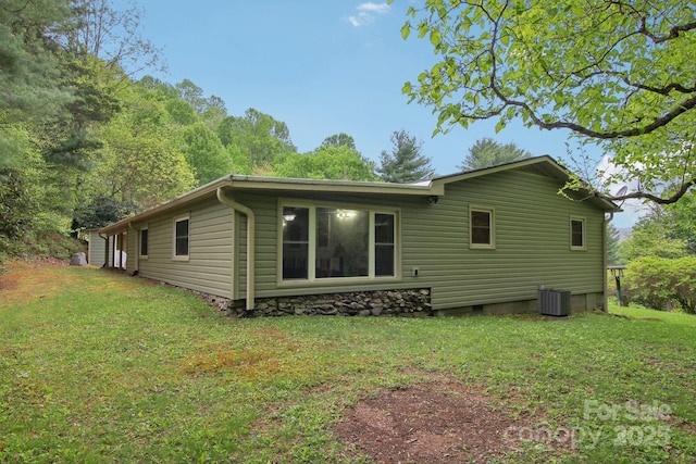 51 Atari Rd, Waynesville, NC 28786 - view of side of home with central air condition unit, a lawn, and crawl space