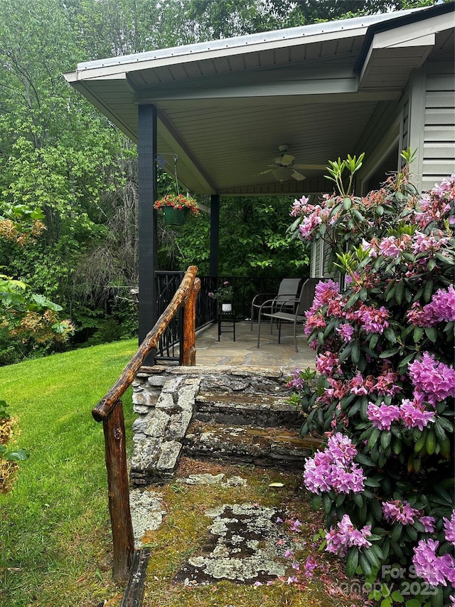 51 Atari Rd, Waynesville, NC 28786 - wooden porch with a ceiling fan and a lawn