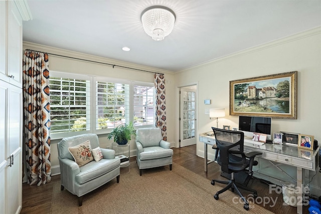 office space featuring wood finished floors, ornamental molding, baseboards, and a chandelier