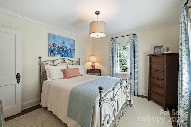bedroom with baseboards and ornamental molding