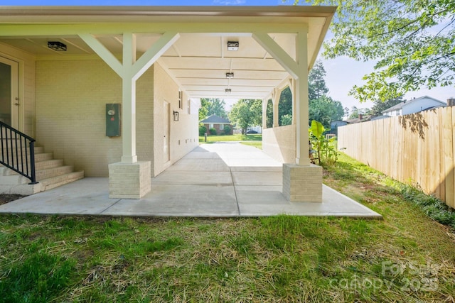 view of patio / terrace featuring fence