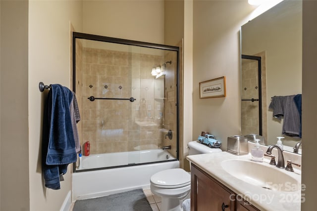 20017 Bragg, Chapel Hill, NC 27517 - bathroom featuring vanity, toilet, bath / shower combo with glass door, and tile patterned floors