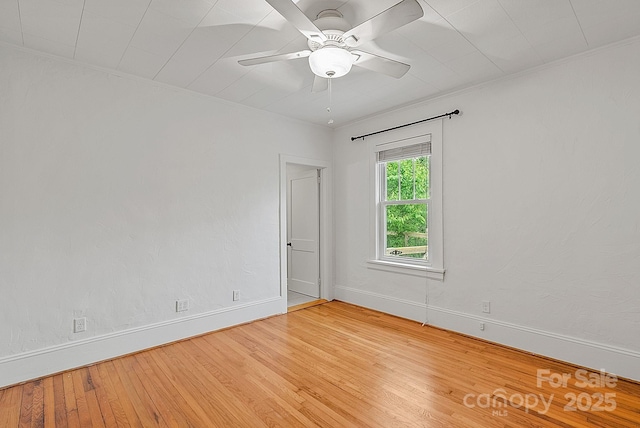 30 Joyner Ave, Asheville, NC 28806 - spare room featuring light wood-style flooring, baseboards, a ceiling fan, and crown molding