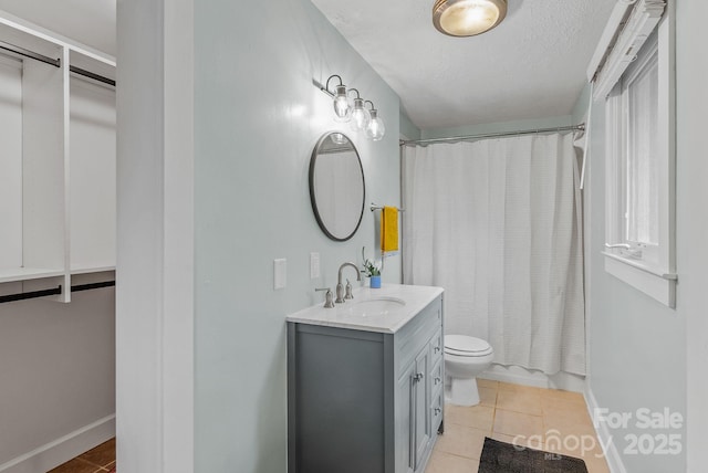 30 Joyner Ave, Asheville, NC 28806 - bathroom with tile patterned flooring, toilet, baseboards, vanity, and a textured ceiling
