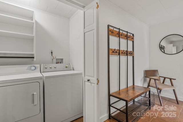 30 Joyner Ave, Asheville, NC 28806 - washroom featuring washing machine and clothes dryer, crown molding, light tile patterned floors, and baseboards