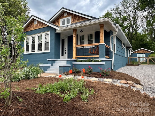 30 Joyner Ave, Asheville, NC 28806 - view of front facade featuring a porch, brick siding, and an outbuilding