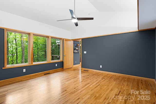 18 Balsam Ct, Arden, NC 28704 - spare room with wood finished floors, ceiling fan, lofted ceiling, and baseboards
