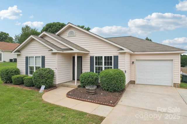 single story home with an attached garage, concrete driveway, and a front yard