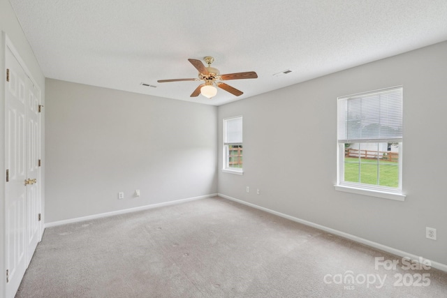 unfurnished bedroom with baseboards, carpet, and a ceiling fan