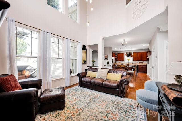 14940 Carbert Ln, Huntersville, NC 28078 - living room with healthy amount of natural light, wood finished floors, and a high ceiling