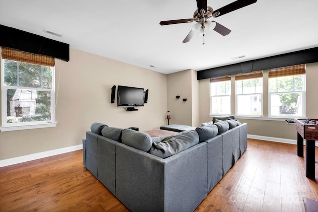 14940 Carbert Ln, Huntersville, NC 28078 - living area featuring plenty of natural light, light wood-style flooring, a ceiling fan, and baseboards