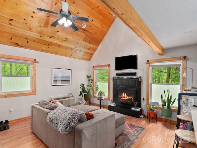 416 Secluded Cv, Waynesville, NC 28785 - living room featuring wood finished floors, a tile fireplace, a ceiling fan, and baseboards