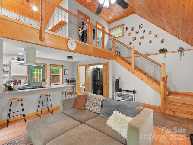 416 Secluded Cv, Waynesville, NC 28785 - living area with stacked washer / drying machine, wooden ceiling, stairs, high vaulted ceiling, and ceiling fan