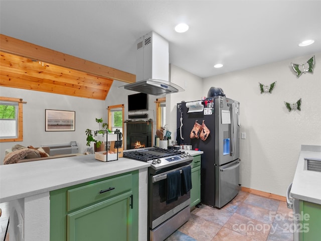 416 Secluded Cv, Waynesville, NC 28785 - kitchen with stainless steel appliances, green cabinets, island range hood, a warm lit fireplace, and recessed lighting