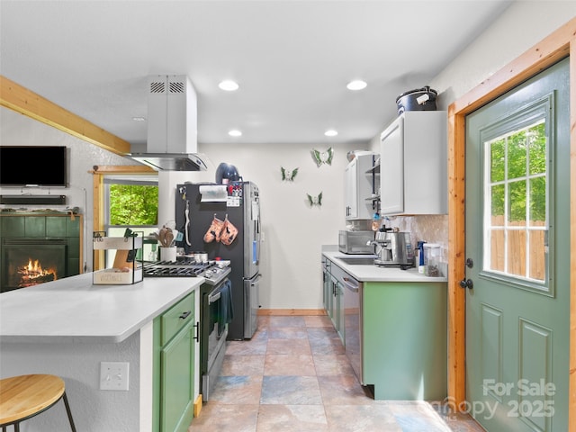 416 Secluded Cv, Waynesville, NC 28785 - kitchen with island range hood, appliances with stainless steel finishes, green cabinetry, light countertops, and recessed lighting