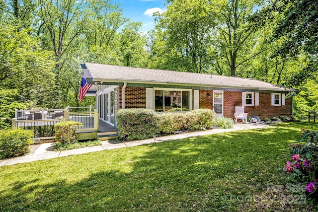 2044 Glenheath Dr, Hendersonville, NC 28791 - single story home featuring brick siding, a wooden deck, and a front yard
