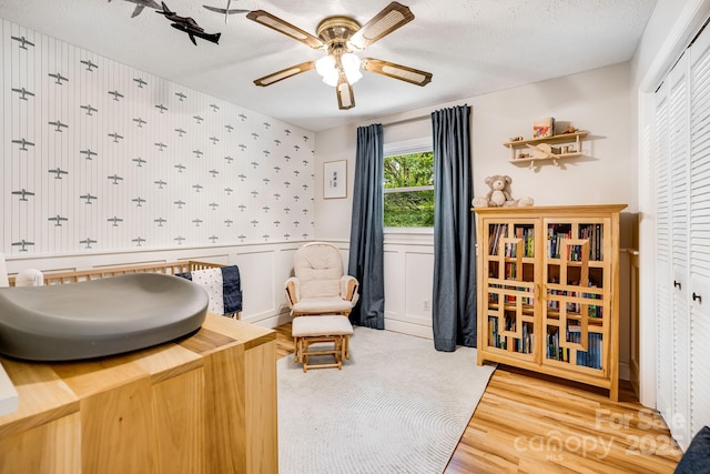 2044 Glenheath Dr, Hendersonville, NC 28791 - sitting room with ceiling fan, wood finished floors, a textured ceiling, and wallpapered walls