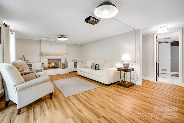 2044 Glenheath Dr, Hendersonville, NC 28791 - living room with wood finished floors, a brick fireplace, and baseboards