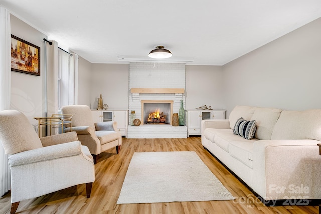 2044 Glenheath Dr, Hendersonville, NC 28791 - living room with light wood-type flooring, ornamental molding, and a fireplace
