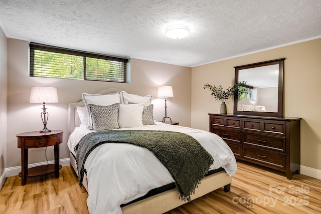 2044 Glenheath Dr, Hendersonville, NC 28791 - bedroom featuring light wood finished floors, a textured ceiling, and baseboards