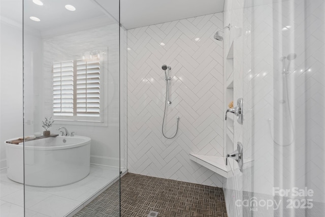 17416 Gillican Overlook Rd, Davidson, NC 28036 - bathroom featuring a shower stall, a freestanding tub, and tile patterned floors