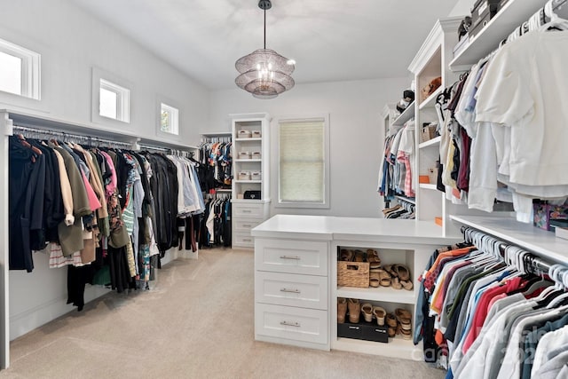 17416 Gillican Overlook Rd, Davidson, NC 28036 - walk in closet featuring light colored carpet and a chandelier