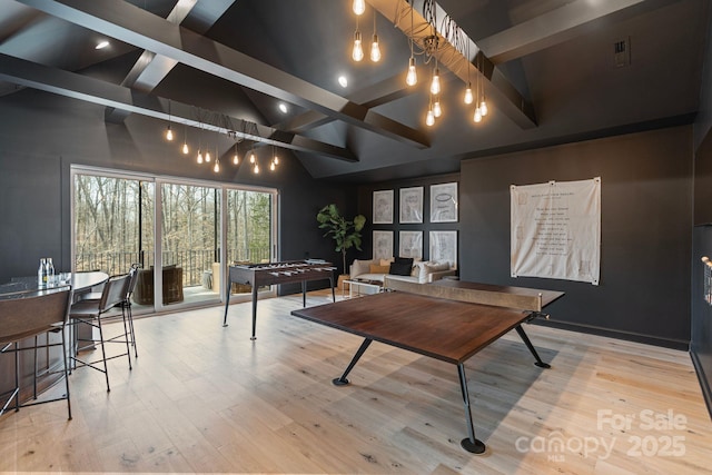 17416 Gillican Overlook Rd, Davidson, NC 28036 - playroom with beamed ceiling, wood finished floors, and high vaulted ceiling