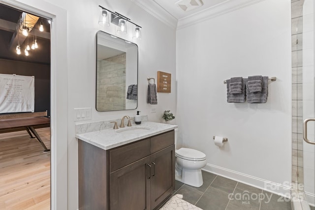 17416 Gillican Overlook Rd, Davidson, NC 28036 - bathroom featuring vanity, crown molding, toilet, a shower with door, and baseboards