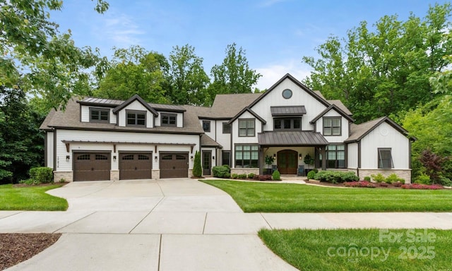 17416 Gillican Overlook Rd, Davidson, NC 28036 - view of front of home featuring a standing seam roof, driveway, board and batten siding, and a front lawn