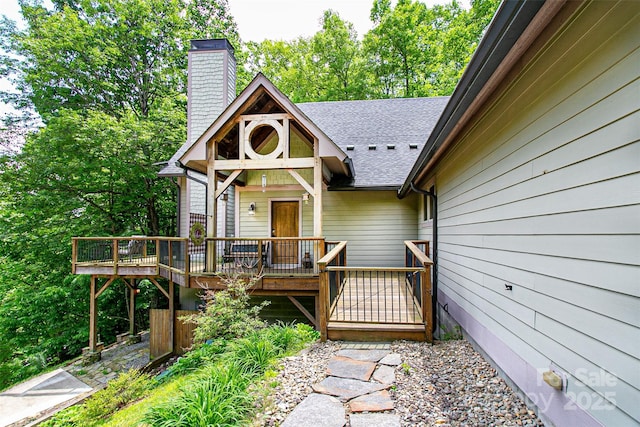 58 Great Aspen Way, Black Mountain, NC 28711 - view of front of home featuring a chimney, a deck, and roof with shingles