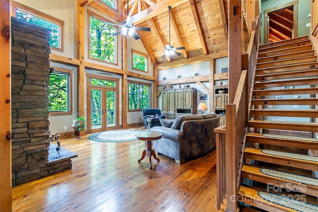58 Great Aspen Way, Black Mountain, NC 28711 - living room featuring high vaulted ceiling, stairs, wood-type flooring, a ceiling fan, and wood ceiling with exposed beams