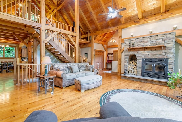 58 Great Aspen Way, Black Mountain, NC 28711 - living room with wood-type flooring, wooden ceiling with exposed beams, stairway, ceiling fan, and a stone fireplace