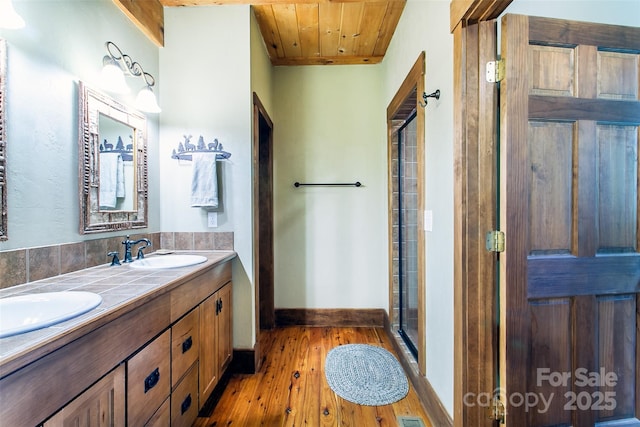 58 Great Aspen Way, Black Mountain, NC 28711 - bathroom featuring double vanity, hardwood / wood-style flooring, a stall shower, baseboards, and wood ceiling