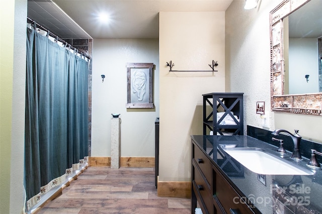 58 Great Aspen Way, Black Mountain, NC 28711 - full bathroom with wood finished floors, vanity, baseboards, and curtained shower