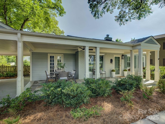 1069 Sedgefield Rd, Charlotte, NC 28209 - view of front of house featuring brick siding and a chimney