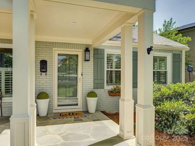 1069 Sedgefield Rd, Charlotte, NC 28209 - property entrance with covered porch and brick siding