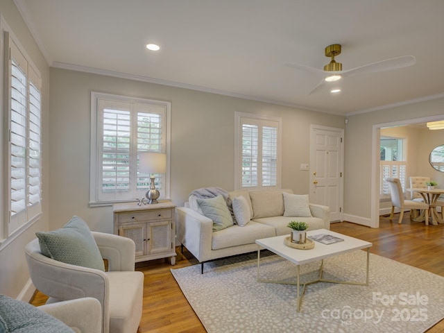 1069 Sedgefield Rd, Charlotte, NC 28209 - living area featuring crown molding, wood finished floors, a ceiling fan, recessed lighting, and baseboards