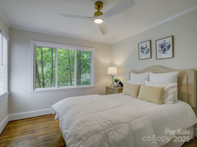 1069 Sedgefield Rd, Charlotte, NC 28209 - bedroom featuring wood finished floors, multiple windows, baseboards, crown molding, and ceiling fan