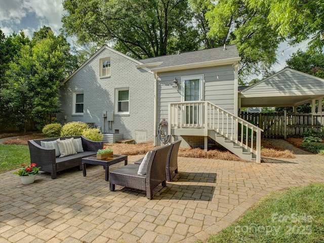 1069 Sedgefield Rd, Charlotte, NC 28209 - back of house featuring an outdoor hangout area, a patio, and brick siding