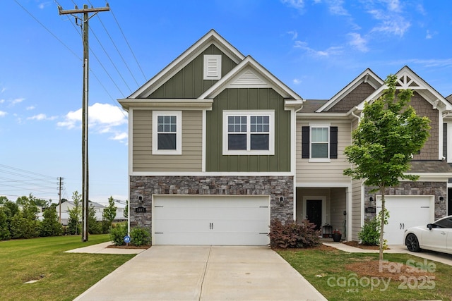 5207 Maynard Hill Dr, Monroe, NC 28110 - craftsman inspired home featuring board and batten siding, a front yard, driveway, a garage, and stone siding
