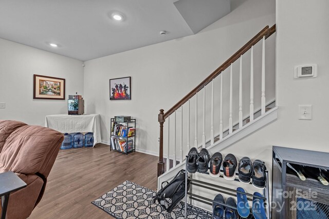 5207 Maynard Hill Dr, Monroe, NC 28110 - living room with wood finished floors, stairway, recessed lighting, and baseboards