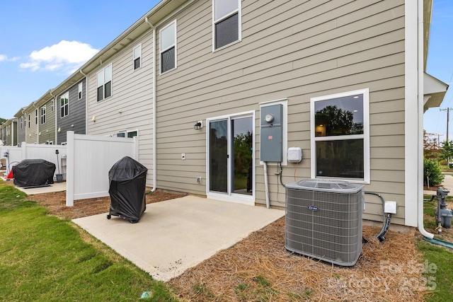 5207 Maynard Hill Dr, Monroe, NC 28110 - back of house with central air condition unit and a patio area