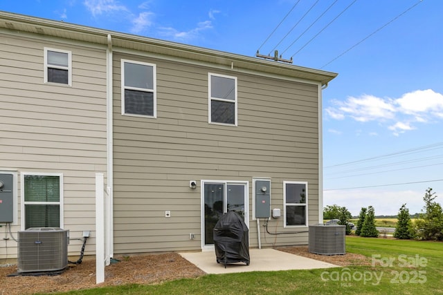 5207 Maynard Hill Dr, Monroe, NC 28110 - rear view of house with central AC unit, a patio, and a yard