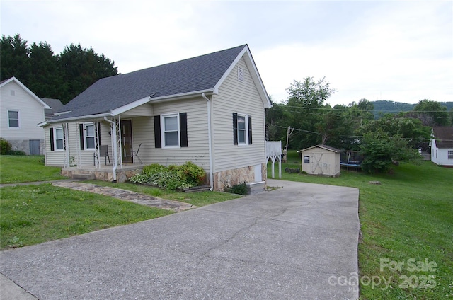 60 3rd St, Marion, NC 28752 - view of front of house with a porch, a front lawn, roof with shingles, and driveway