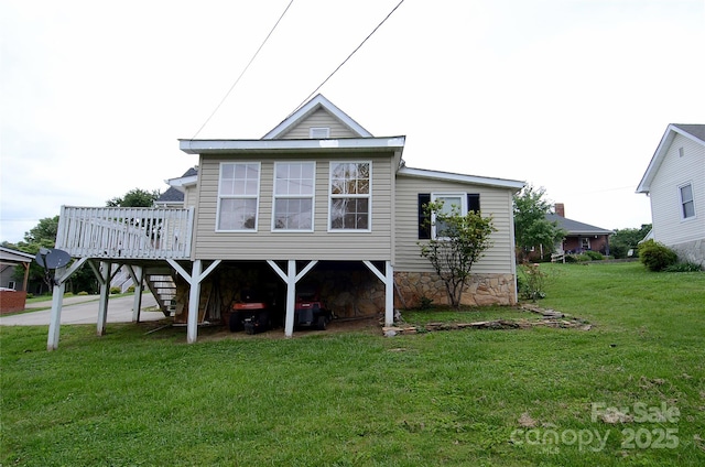 60 3rd St, Marion, NC 28752 - back of property with a deck and a lawn