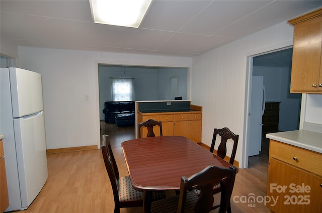 60 3rd St, Marion, NC 28752 - dining room with light wood-style flooring and baseboards