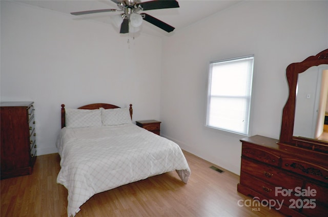 60 3rd St, Marion, NC 28752 - bedroom with wood finished floors and a ceiling fan