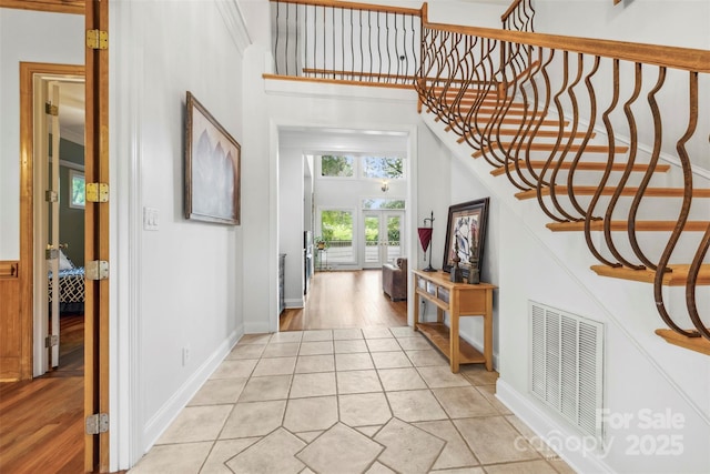 3932 Rounding Run Rd, Charlotte, NC 28277 - entrance foyer featuring stairway, a towering ceiling, and light tile patterned floors